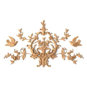 ornate wood wall decor with carved birds