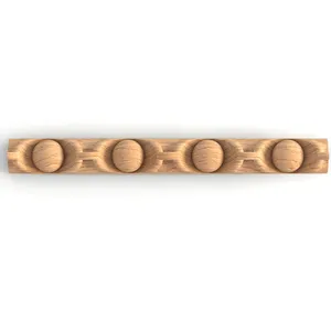 Narrow wooden moulding with carved pearls
