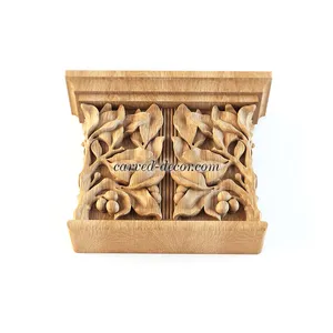 Pilaster caps decorative with bay leaves and berries from beech