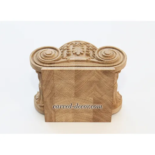 Beech column tops Ionic order with floral elements