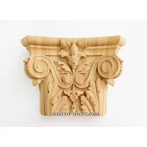 Ornamental pilaster caps with wood carved leaves. scrolls