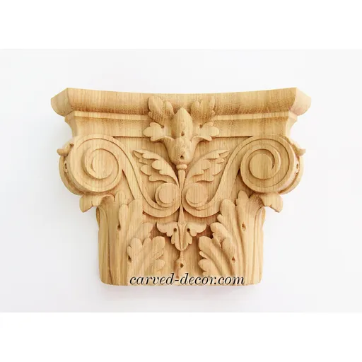 Ornamental pilaster caps with wood carved leaves. scrolls