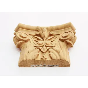Ornamental pilaster caps with wood carved leaves and flowers