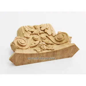 Oak ornamental pilaster caps with wood carved leaves. scrolls and flowers
